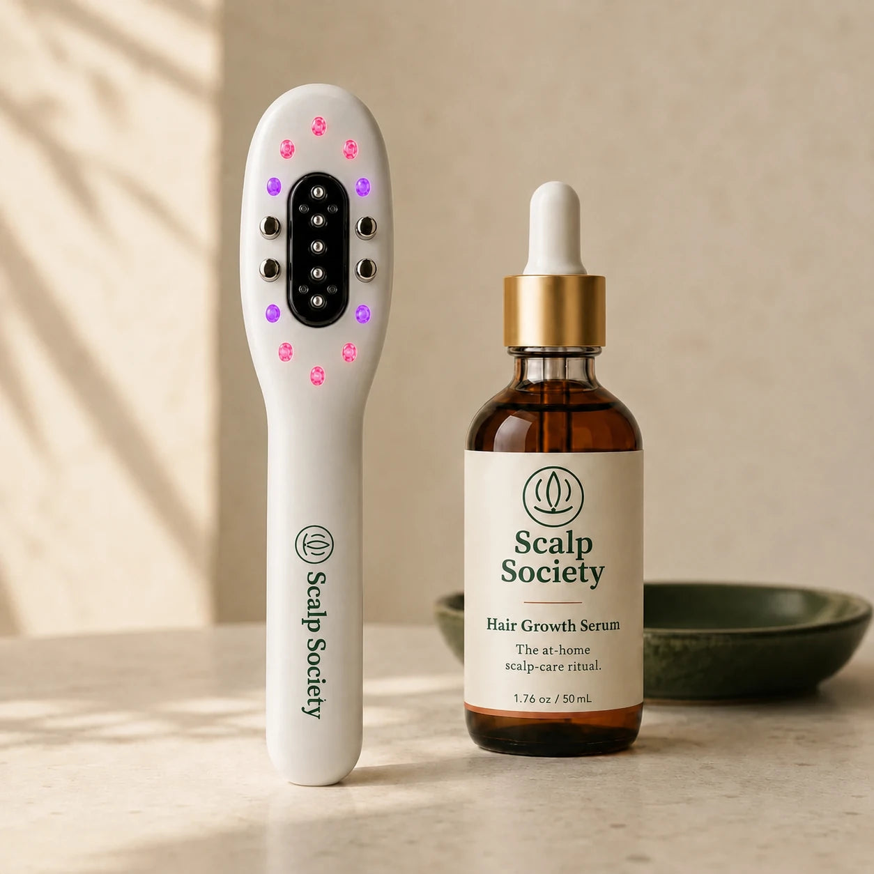 Scalp Society Wand and serum styled on a warm bathroom counter